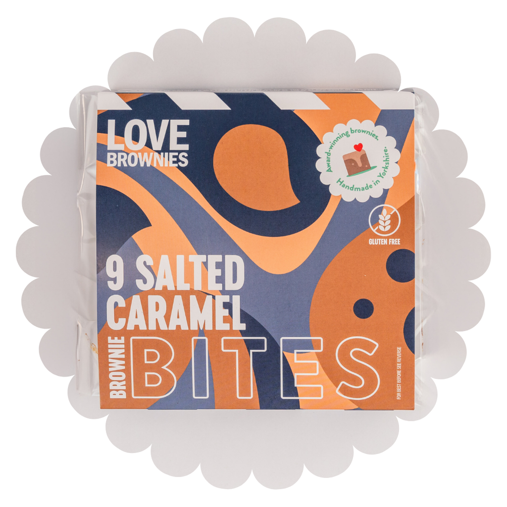 Colourful box in blue and tan containing 9 dairy free, nut free, gluten free, egg free, salted caramel chocolate brownie bites