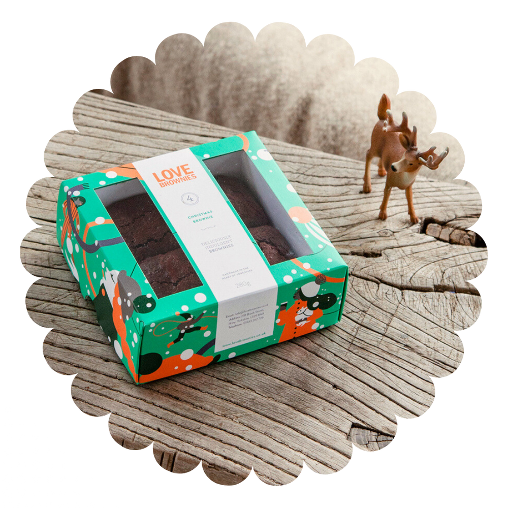 Colourful Christmas themed gift box containing 4 Mince pie flavour gluten free brownies