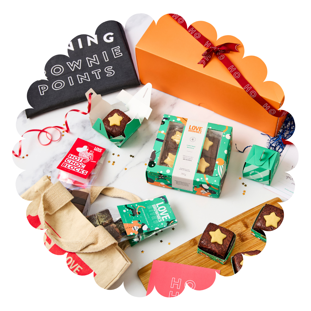 Orange gift hamper with grey earning brownie points teatowel, box of gluten free Christmas brownies, individual christmas chocolate brownies, chocolate brownie bites, hot chocolate blocks