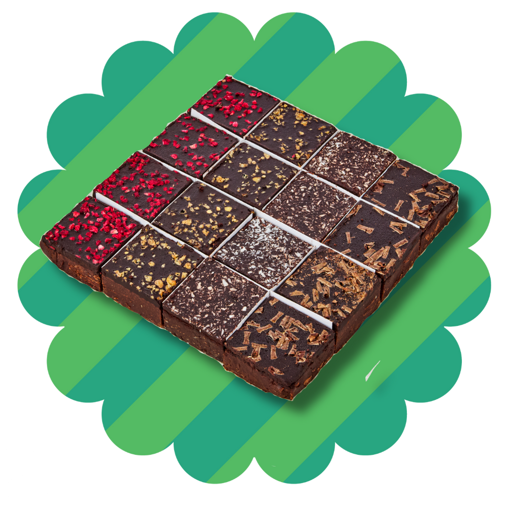 Slab of dairy free, nut free, egg free chocolate brownies. raspberry, coconut, honeycomb and double chocolate flavours